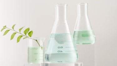 Lab instruments with light green color liquir in neutral background image ex Canva