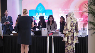 Delegates collecting their badges at the registration desk of the Global Fragrance Summit 2025 in Singapore